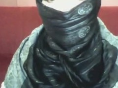 Bored arab hotty in hijab plays on her calculator