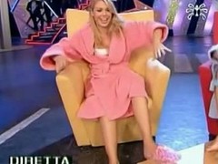 In a curious TV show a hot tow-haired cut up around a bathrobe happily shows off and seductively strokes her sexy feet and long trotters aired live now archived or download